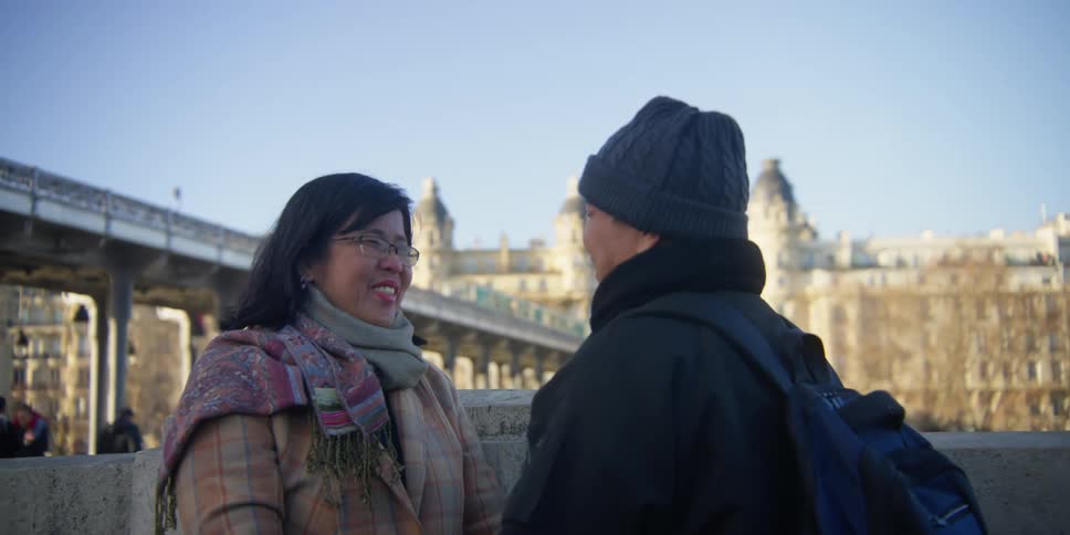 Smiling couple talking in the middle of the city during the day