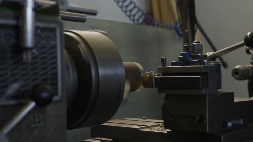 A lathe with a circular part is moving quickly