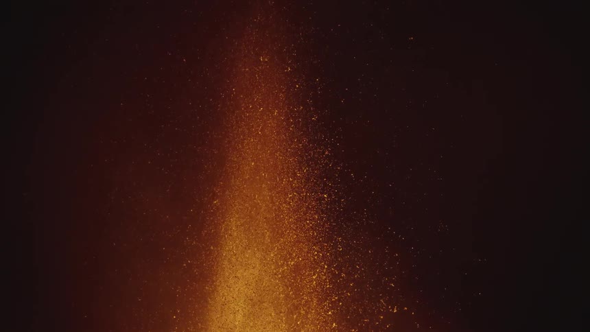 A volcanic eruption with lava being expelled upwards
