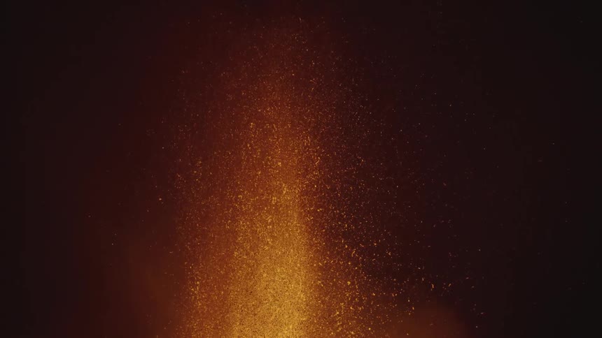 Volcano lava splashing up and slow motion at night