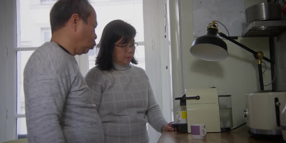 Couple making coffee in the kitchen at home