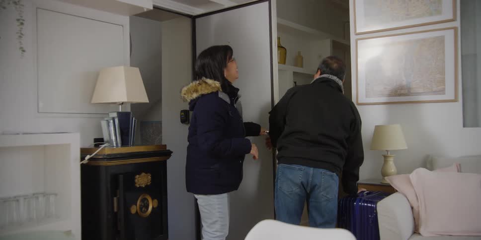 Traveling couple arrives at a nice hotel room