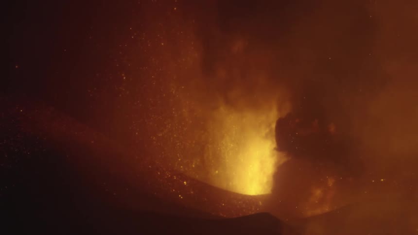 A massive volcanic eruption throws out lava and flames