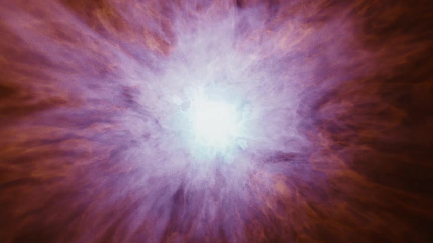 Center of orange colored nebula shines a bright blue white