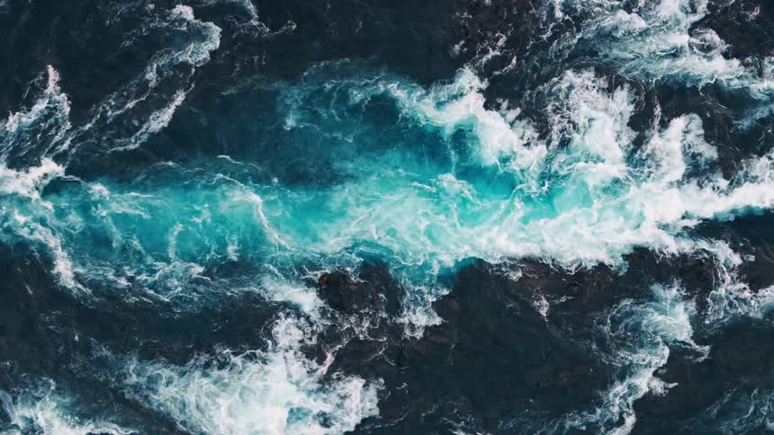 Water cascades down to a waterfall