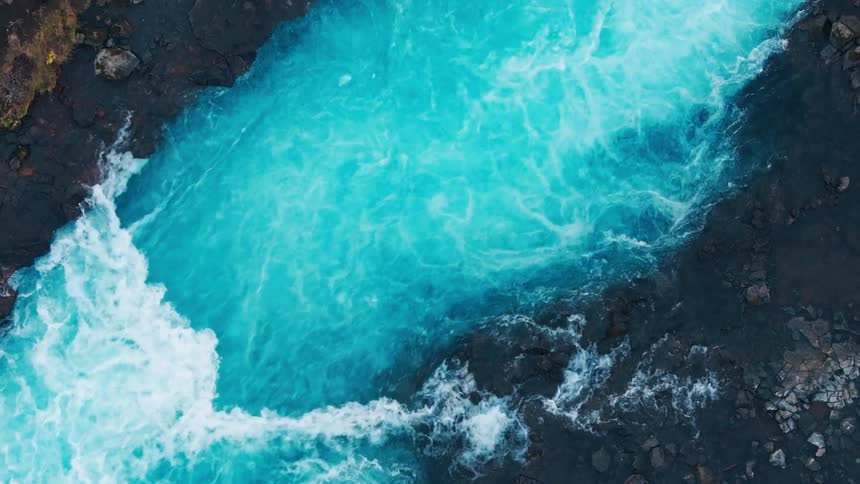 Aerial of a river with crystal blue waters during dusk