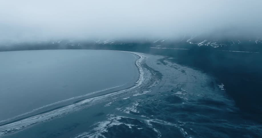 Aerial view of sea ice sheets during dusk