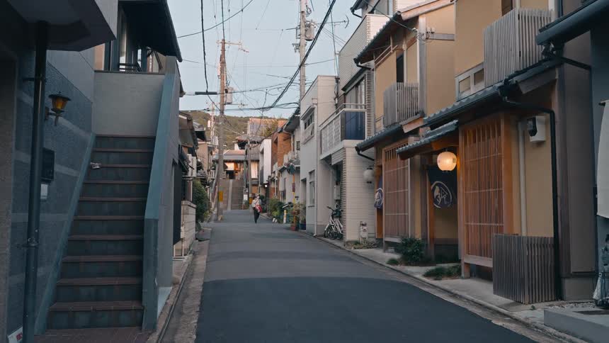 A person is walking down the alley