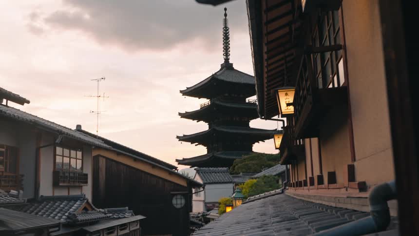 A tall pagoda sits near homes