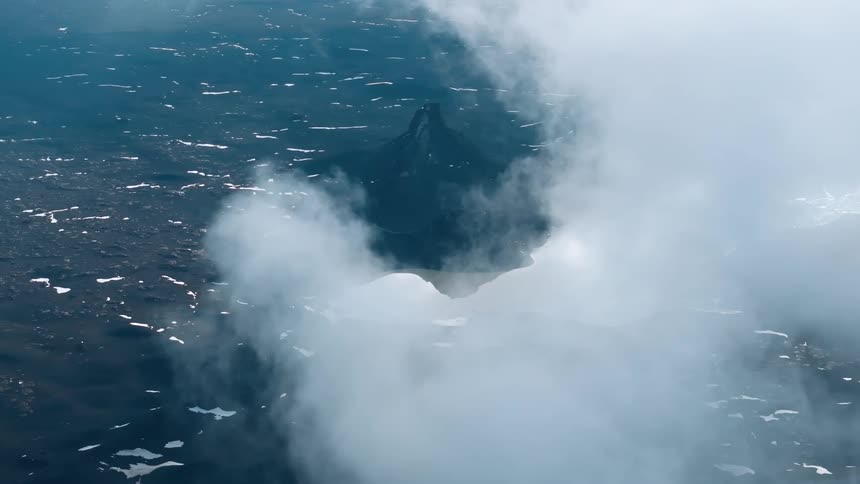 Aerial of mountains with melting snow during sunset