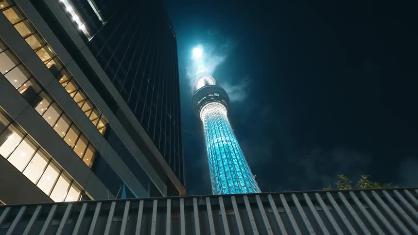 A night view of the tokyo skytree and surrounding buildings