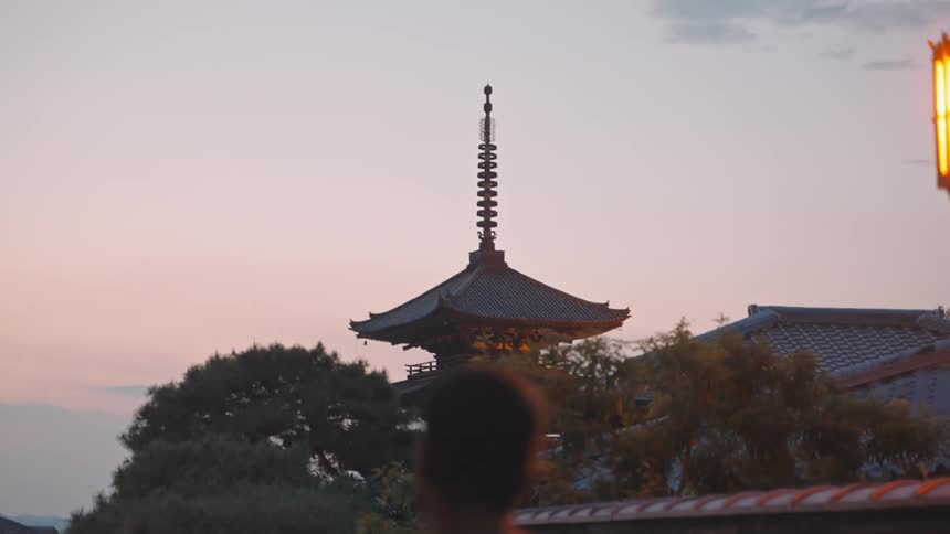 A scene of a pagoda during sunrise or sunset