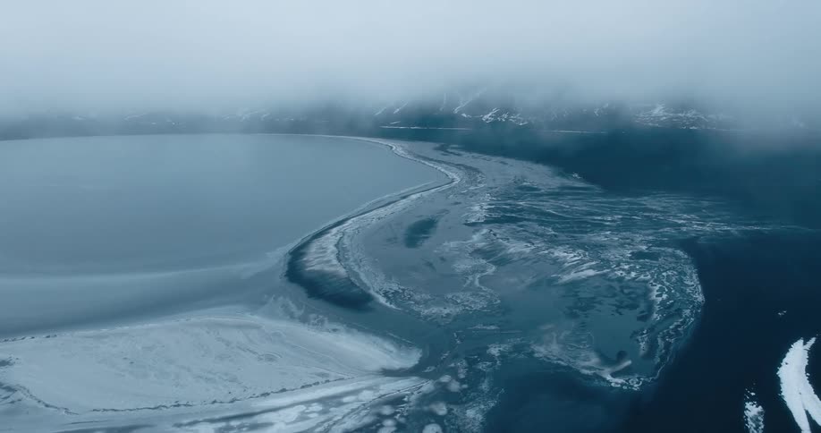 Aerial of frozen arctic sea during dusk