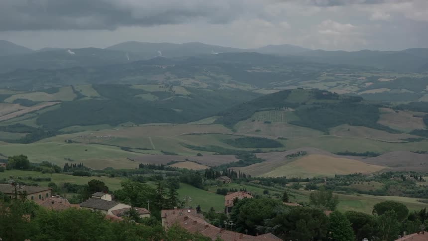 Scenic view of green fields and hills