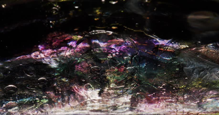 Closeup on a liquid and dense gooey texture in abstract motion