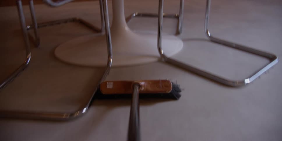 A first person perspective shows a broom cleaning around a room