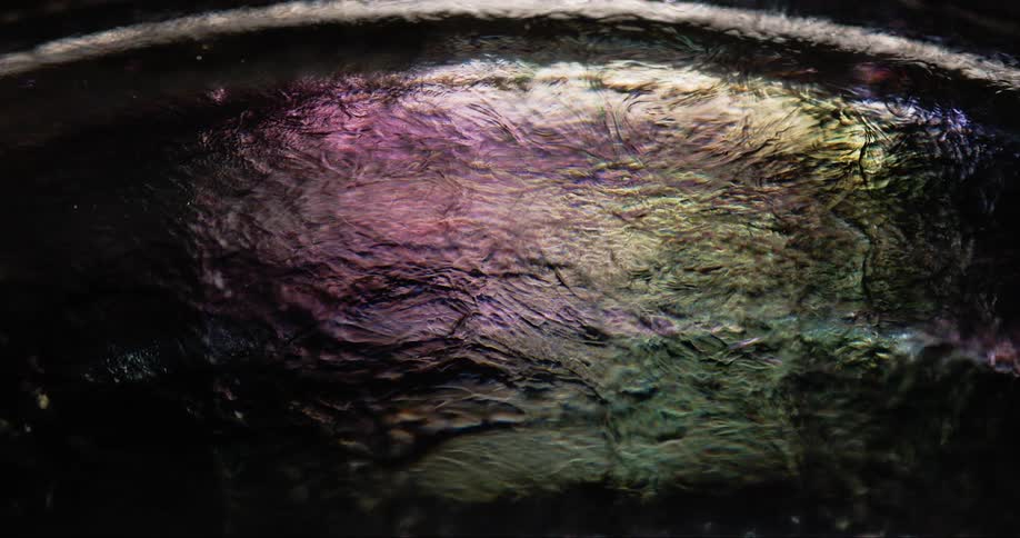 The liquid moves and reflects light