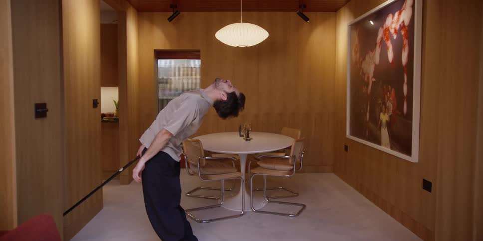 A clip of a man sweeping and dancing