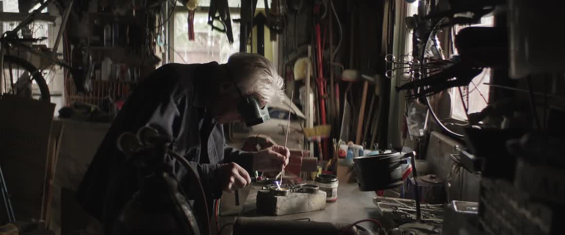 A clip of a blacksmith working in a workshop