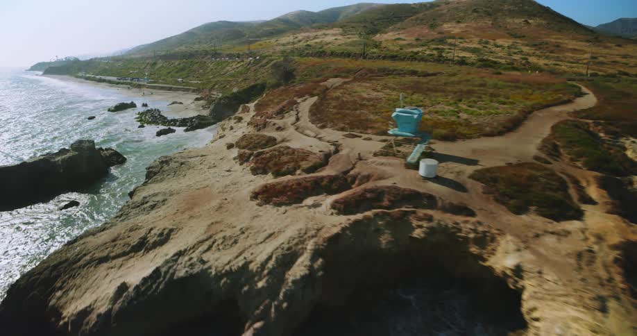 Aerial panorama of a peninsula with mountains and vegetation by the sea