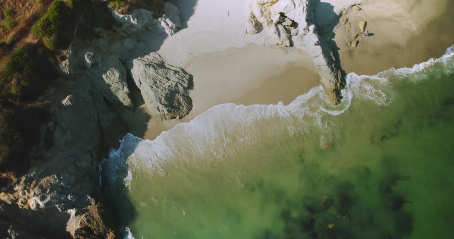 The waves are crashing against the shore