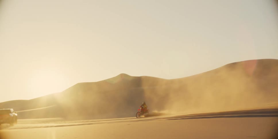 A clip of motor and bike racing in the desert