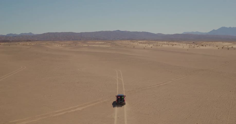 Red pickup truck transporting email on a deserted land