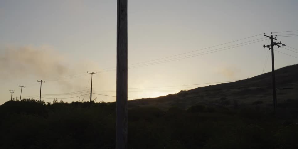 Power poles across the hills one morning