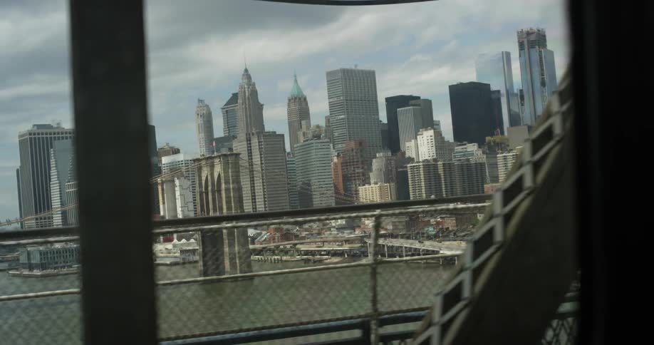 Passing view of a large city as seen while moving across a bridge