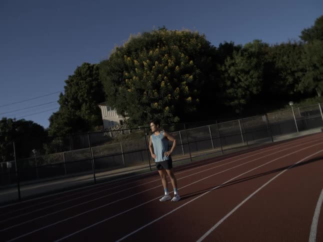 A runner standing still on the track