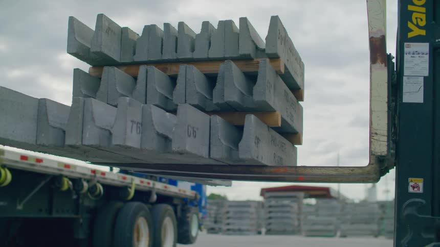 Forklift climbing a concrete block