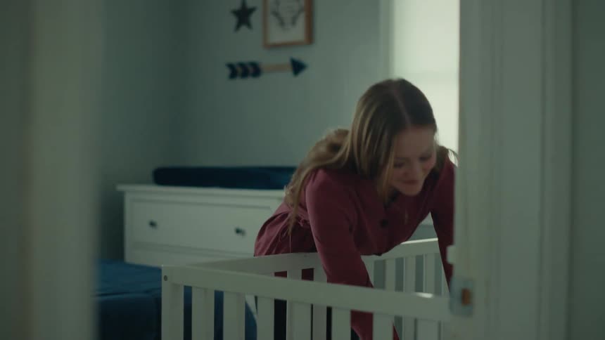 A clip of a mother raising her kid from the bed