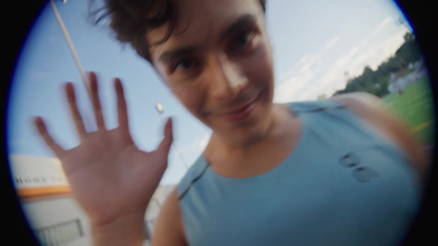 Closeup of a mans face on an athletics track