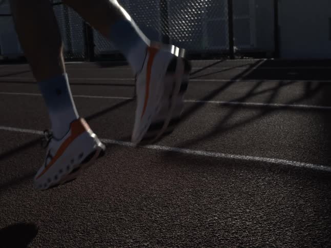 A man wearing running shoes exercising outdoors
