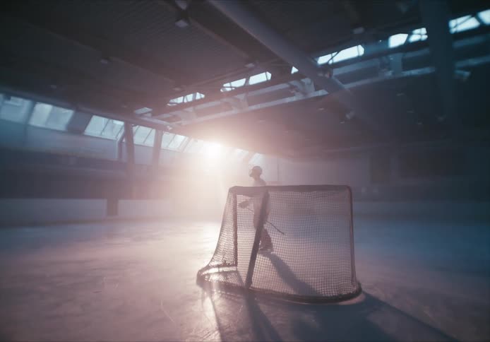 A man is playing hockey by himself
