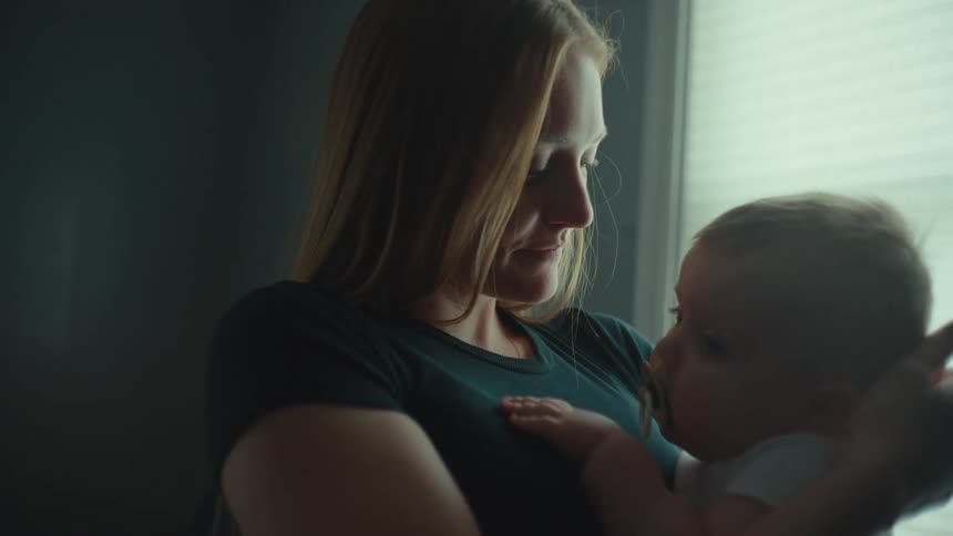 A mother holds her baby