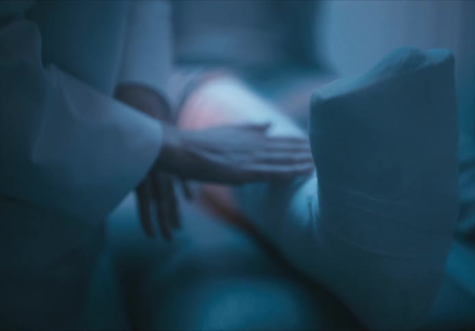 A doctor is examining a patient