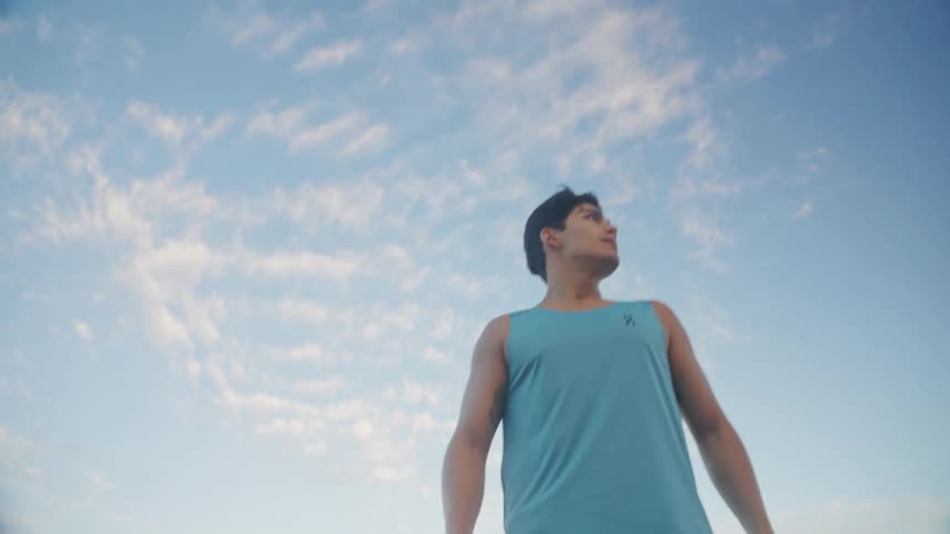 Man in an openair place wearing a sports tank top