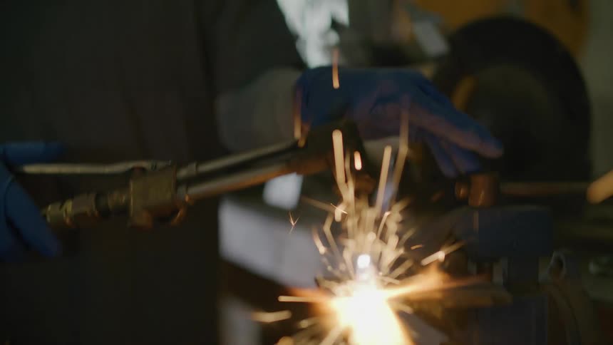 A welder is welding metal