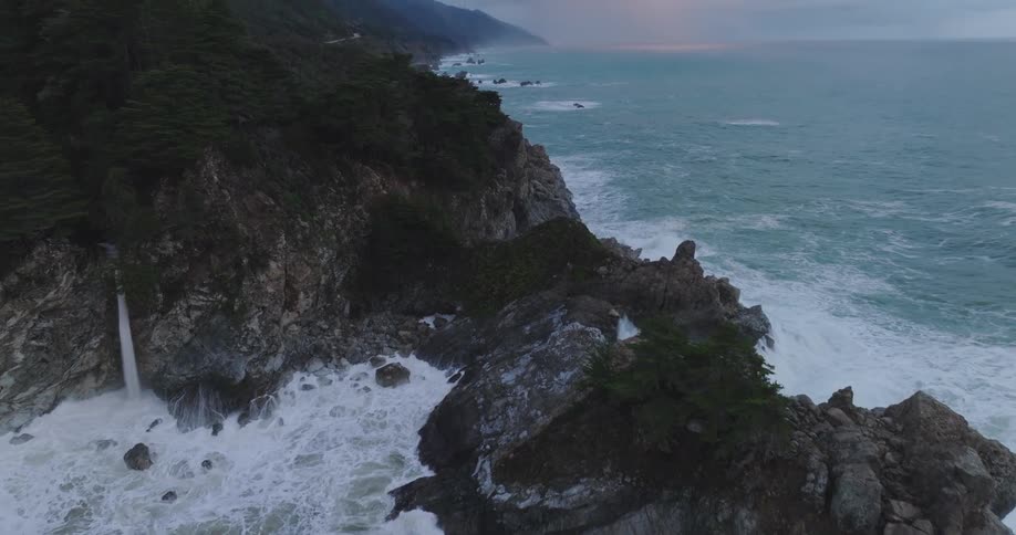 Strong waves crash against a rocky coast