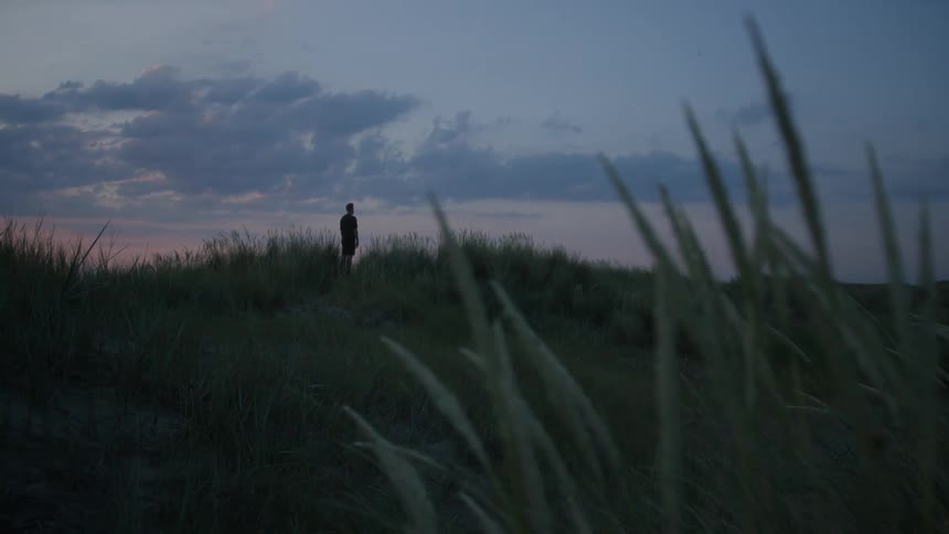 A person stands in the distance