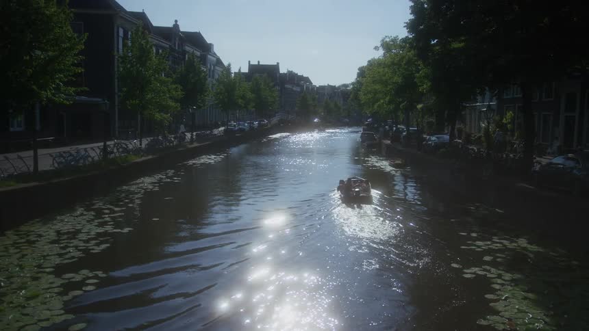 Landscape of a central lake as a canal for boats and on the sides a residential town