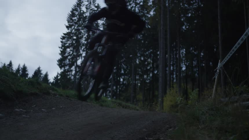 Person climbing a hill on a mountain bike maneuver