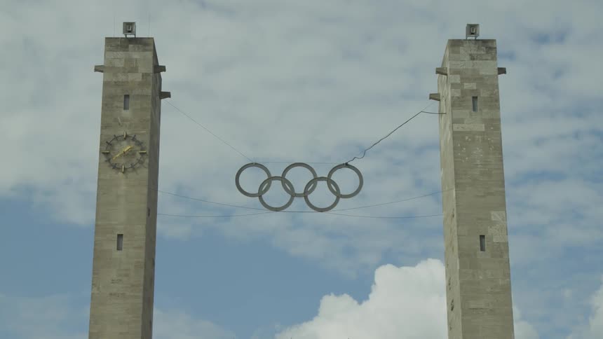 Two pillars with the olympic games central logo