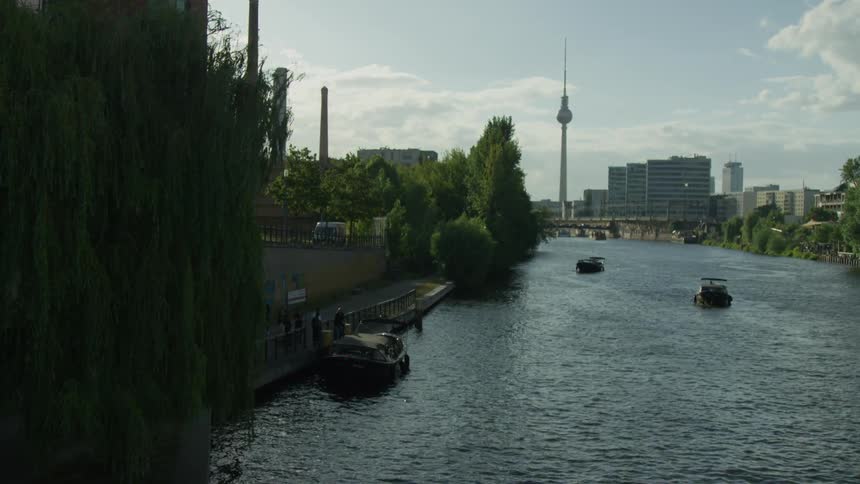 Boats on a river near a city