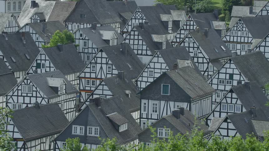 Identical houses in a suburban neighborhood during the day