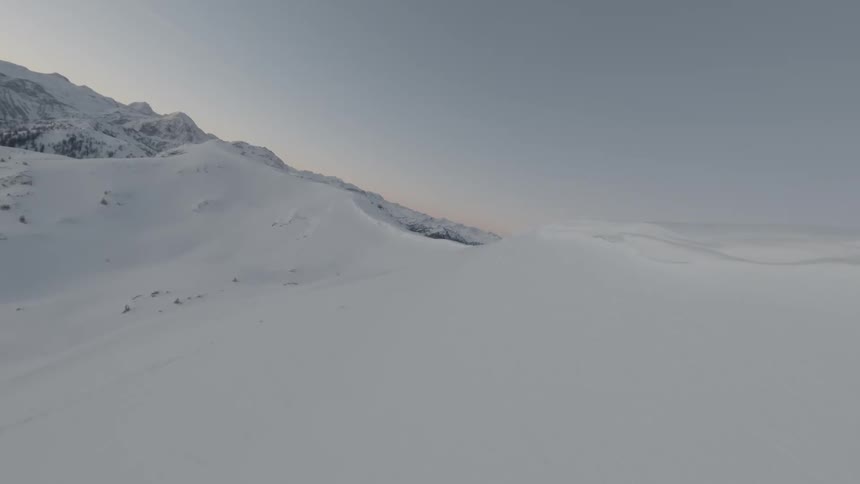 Aerial of snow mountain during sunset