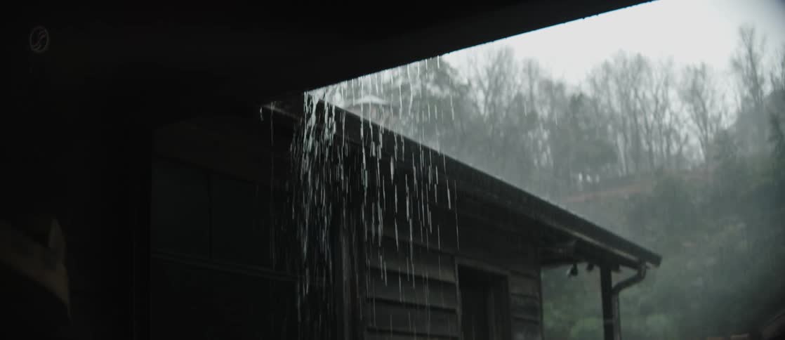 Wooden house in rural area on a rainy day