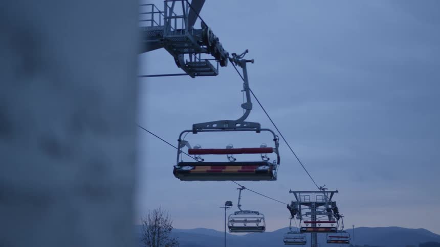 Ski lift cars move along cables
