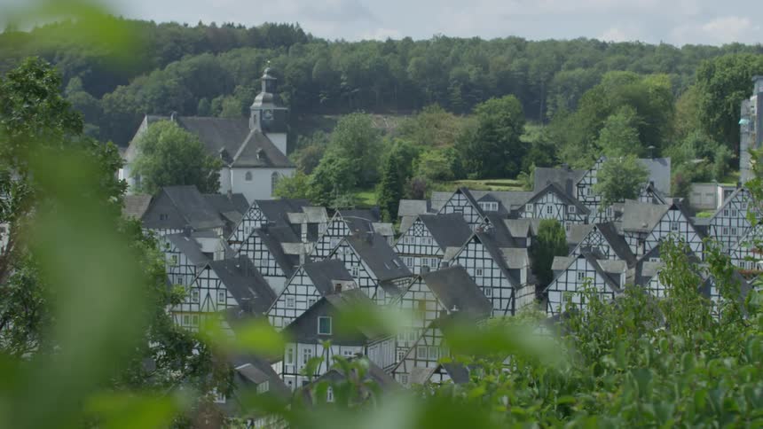 A small rural town with matching colorful houses